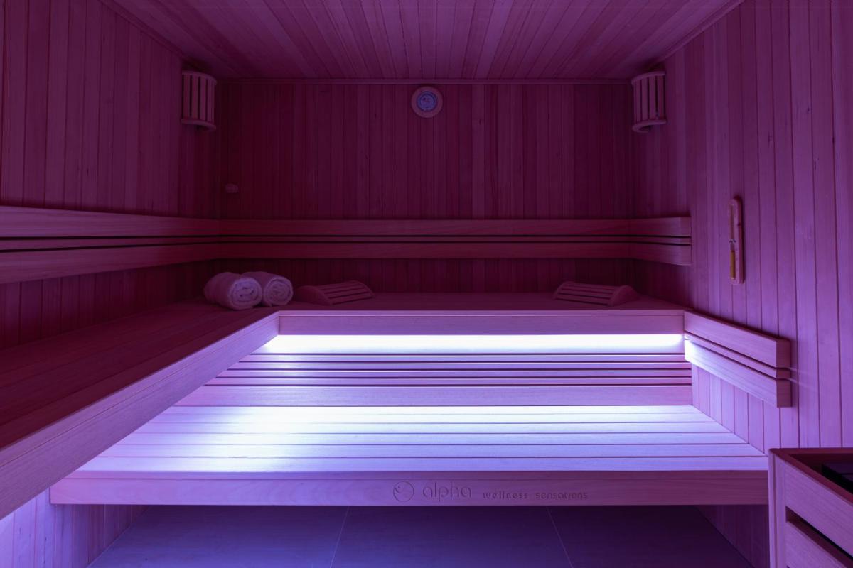 Un ou plusieurs lits dans un hébergement de l'établissement Hôtel & SPA Napoléon