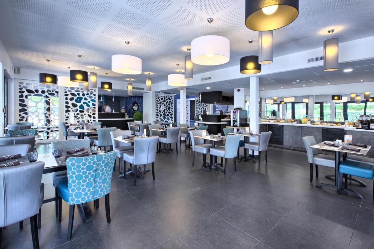 Restaurant ou autre lieu de restauration dans l'établissement Logis Hotel Restaurant & SPA Au Comte d'Ornon