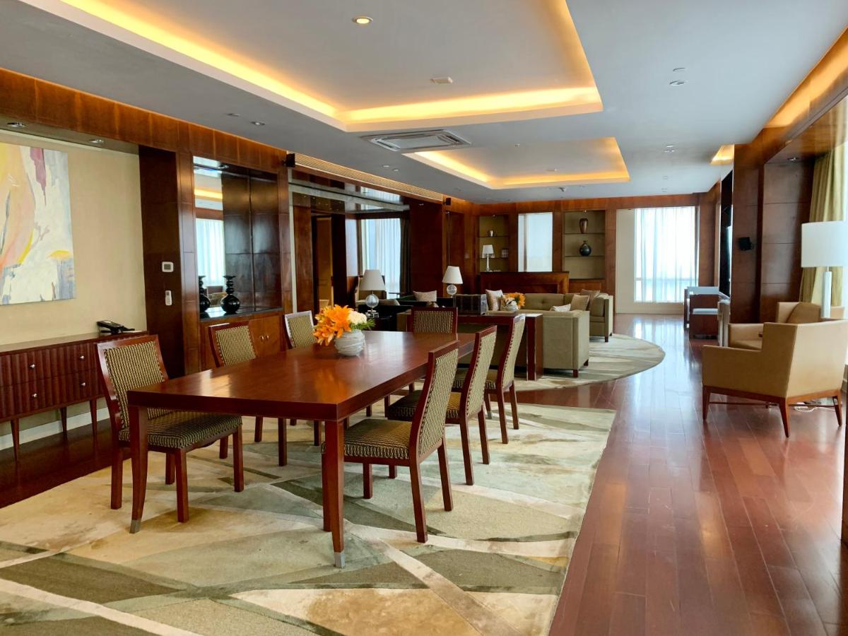 a conference room with a wooden table and chairs at Four Seasons Hotel Mumbai in Mumbai