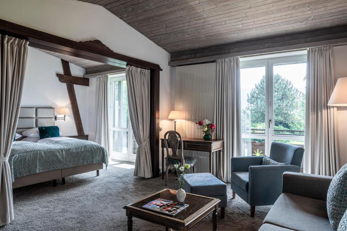 Ein Bett oder Betten in einem Zimmer der Unterkunft Alpenhof Murnau