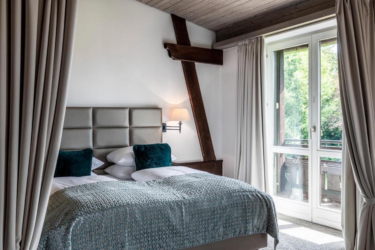 Ein Bett oder Betten in einem Zimmer der Unterkunft Alpenhof Murnau