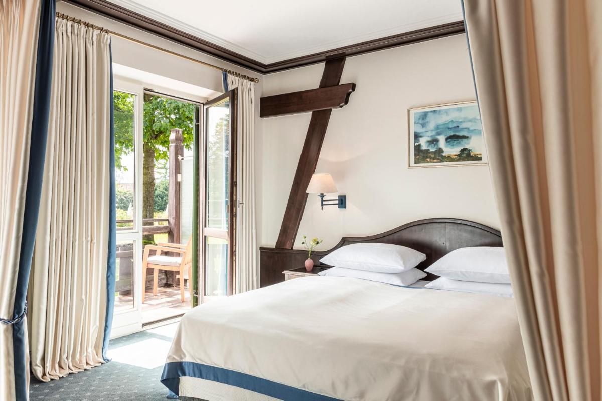 Ein Bett oder Betten in einem Zimmer der Unterkunft Alpenhof Murnau