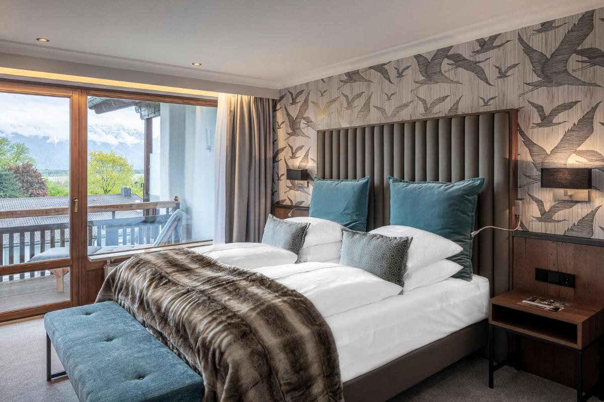Ein Bett oder Betten in einem Zimmer der Unterkunft Alpenhof Murnau