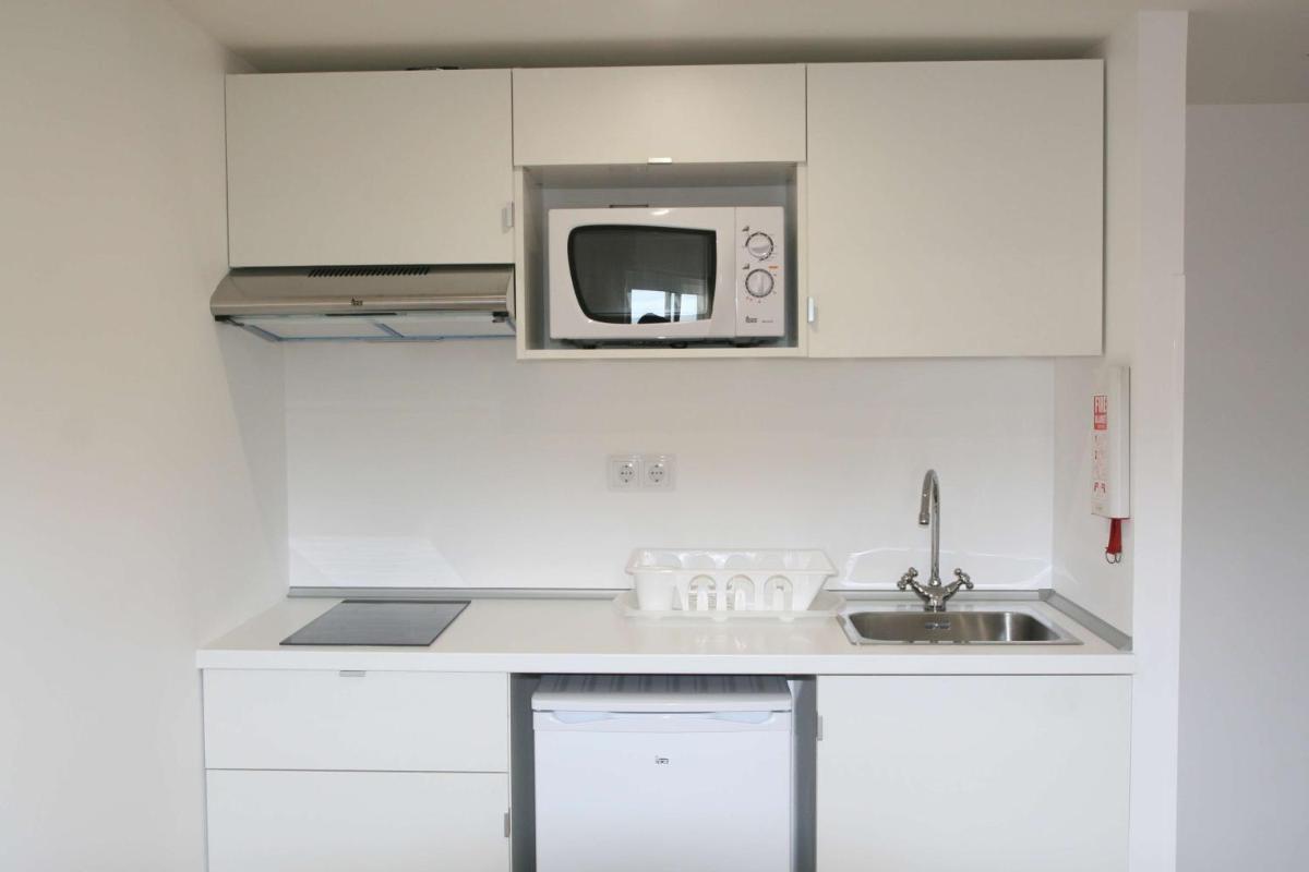 A cozinha ou kitchenette de Florasol Residence Hotel - Dorisol hotels