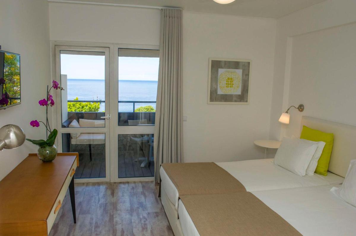 Uma cama ou camas num quarto em Florasol Residence Hotel - Dorisol hotels