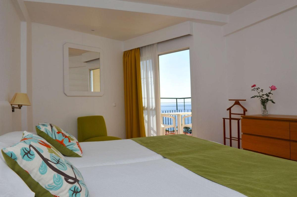 Uma cama ou camas num quarto em Florasol Residence Hotel - Dorisol hotels