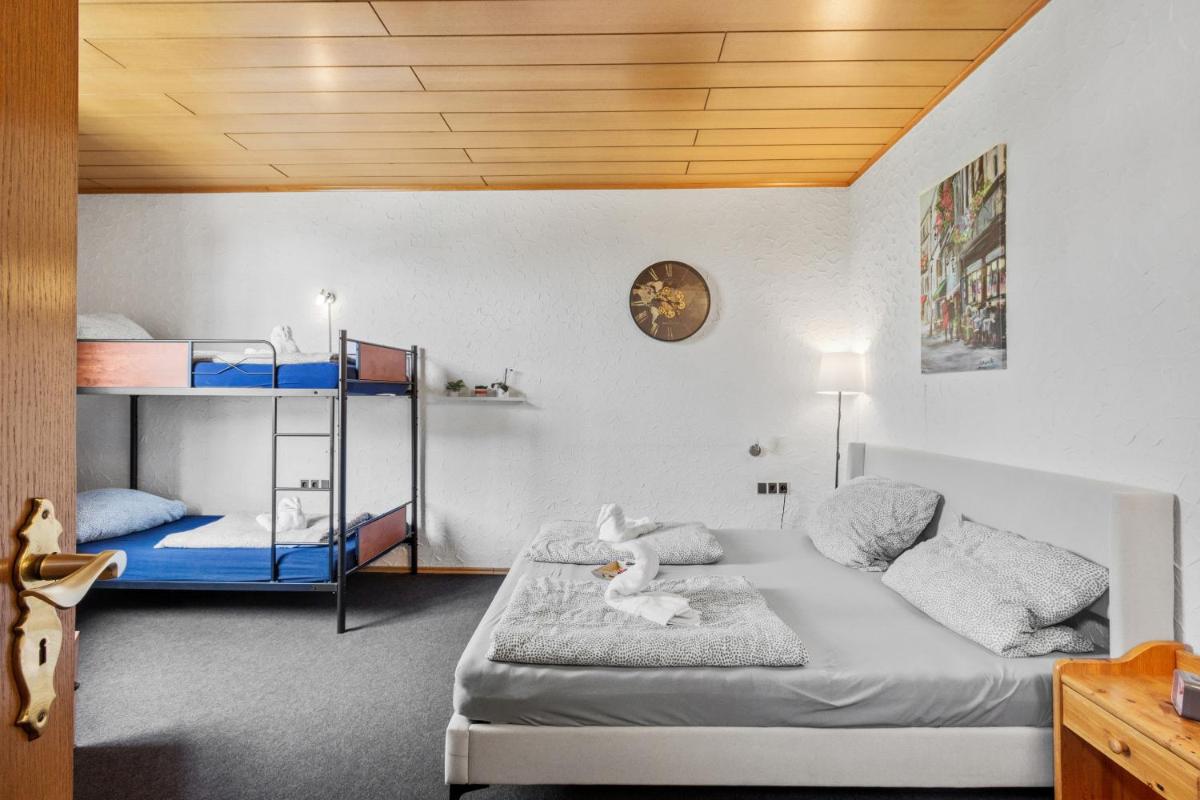 Ein Bett oder Betten in einem Zimmer der Unterkunft Family and Friends Hassloch