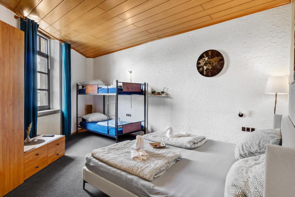 Ein Bett oder Betten in einem Zimmer der Unterkunft Family and Friends Hassloch