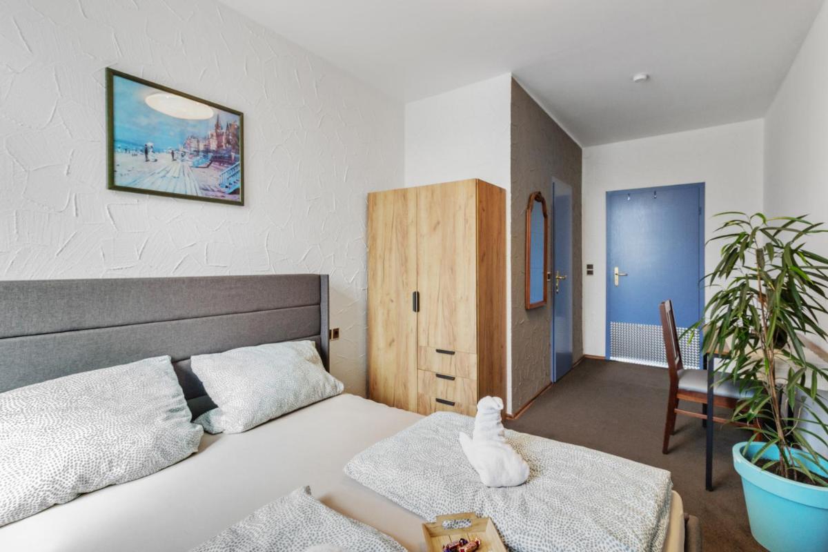 Ein Bett oder Betten in einem Zimmer der Unterkunft Family and Friends Hassloch