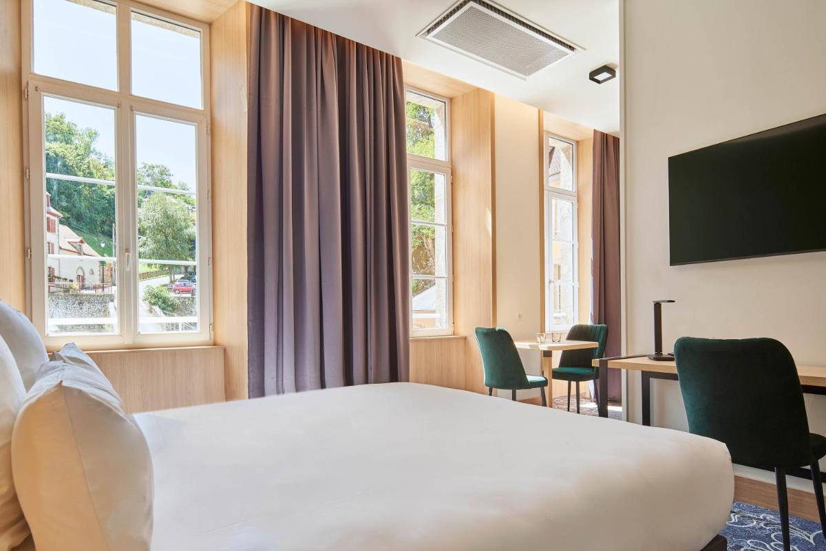 Télévision ou salle de divertissement dans l'établissement Le Grand Hôtel, The Originals Relais