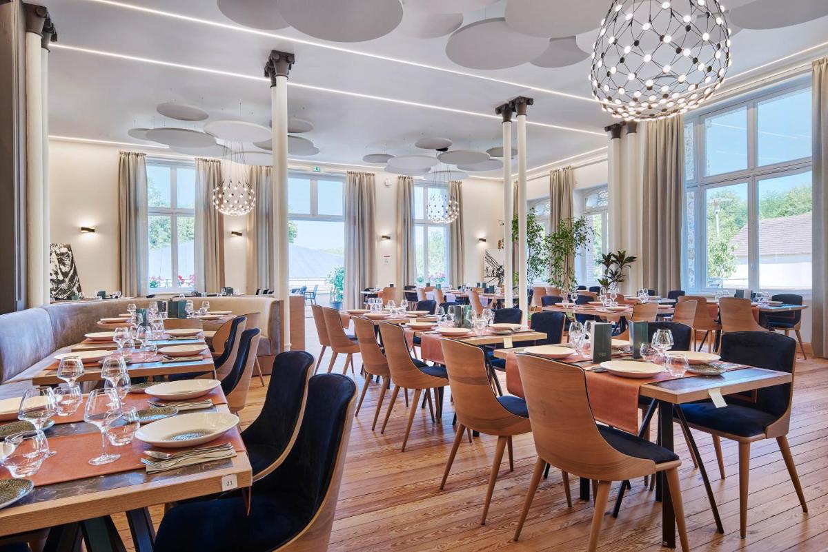 Restaurant ou autre lieu de restauration dans l'établissement Le Grand Hôtel, The Originals Relais