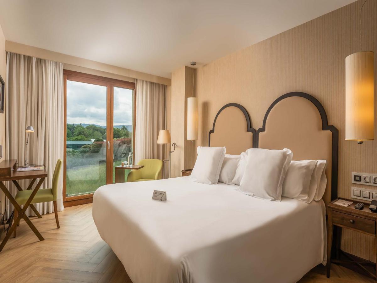 Cama o camas de una habitación en ARTIEM Asturias