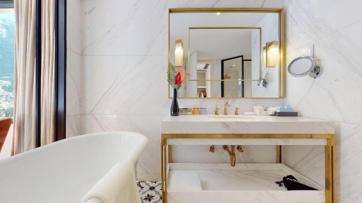 a bathroom with a sink and a mirror at Radisson Hotel Shimla in Shimla