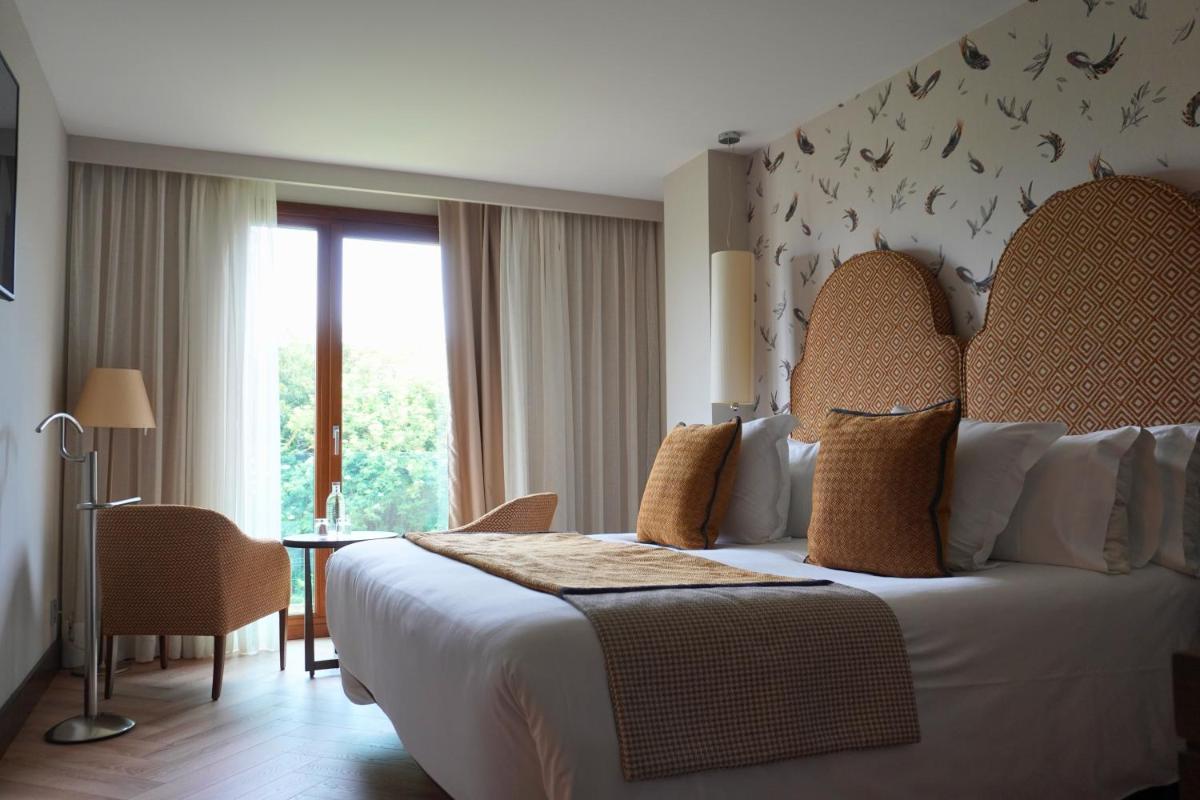 Cama o camas de una habitación en ARTIEM Asturias