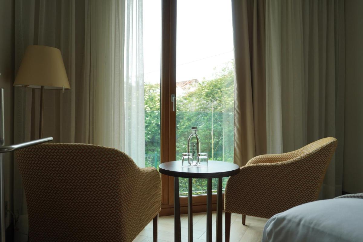 Cama o camas de una habitación en ARTIEM Asturias