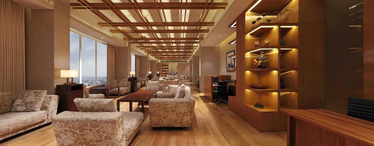 a lobby with a waiting room with couches and a table at DoubleTree by Hilton-Pune Chinchwad in Pune