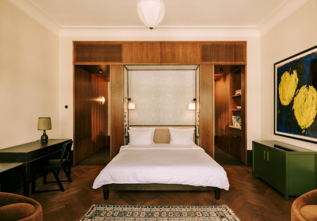 Ein Bett oder Betten in einem Zimmer der Unterkunft Boutique Hotel Château Royal Ein Bett oder Betten in einem Zimmer der Unterkunft Boutique Hotel Château Royal