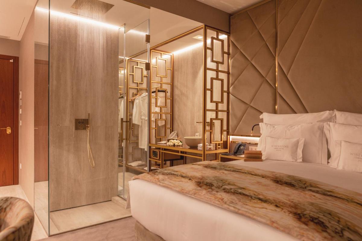 Uma cama ou camas num quarto em Wine & Books Lisboa Hotel