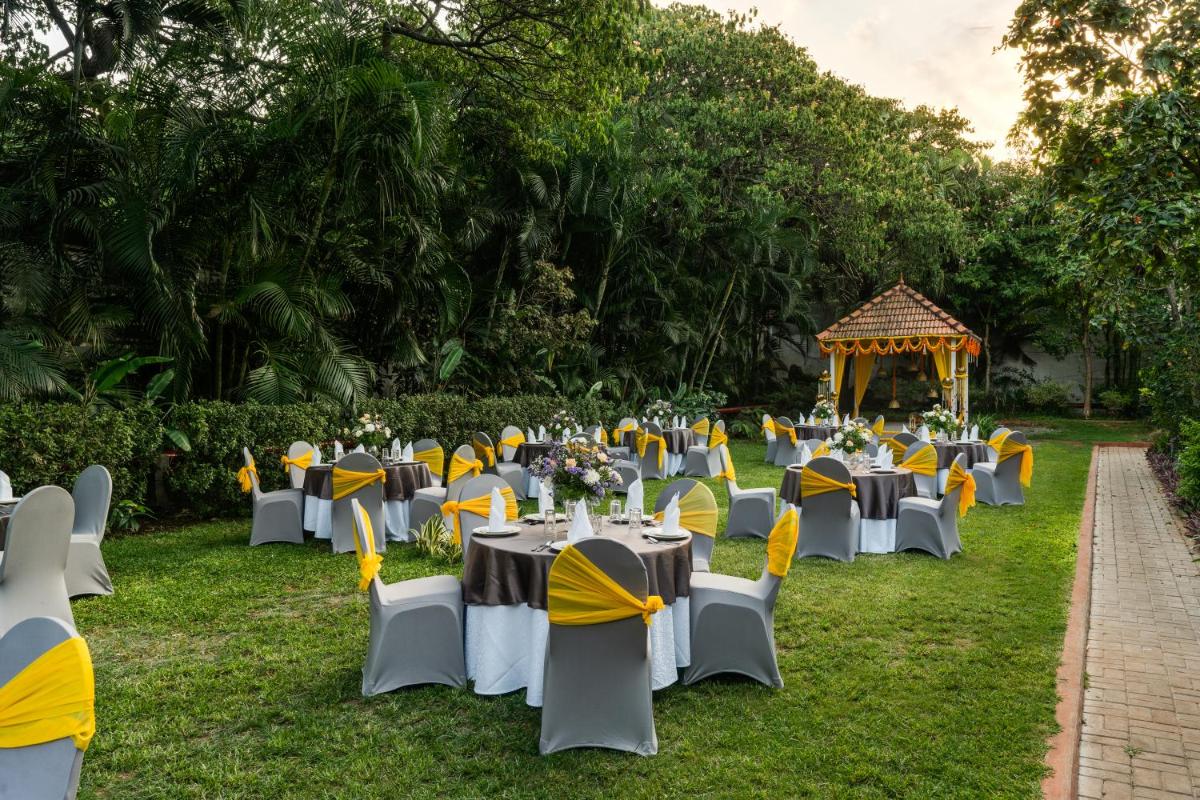 a set up for an event with tables and chairs at Southern Star,Mysore in Mysore