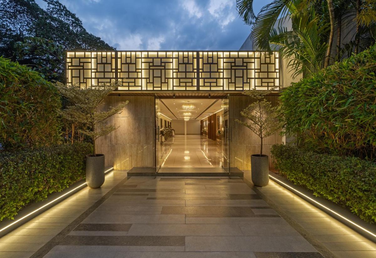 a hallway leading to a building with lights on it at Southern Star,Mysore in Mysore