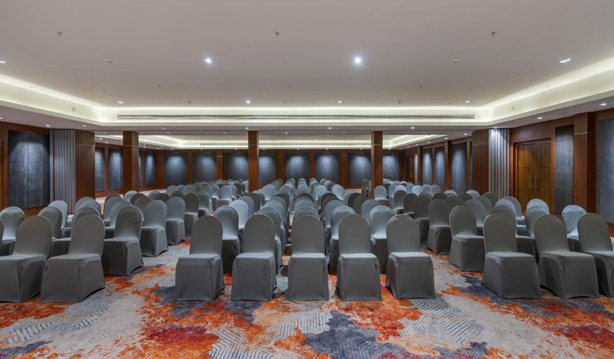 an empty conference room with chairs in it at Southern Star,Mysore in Mysore