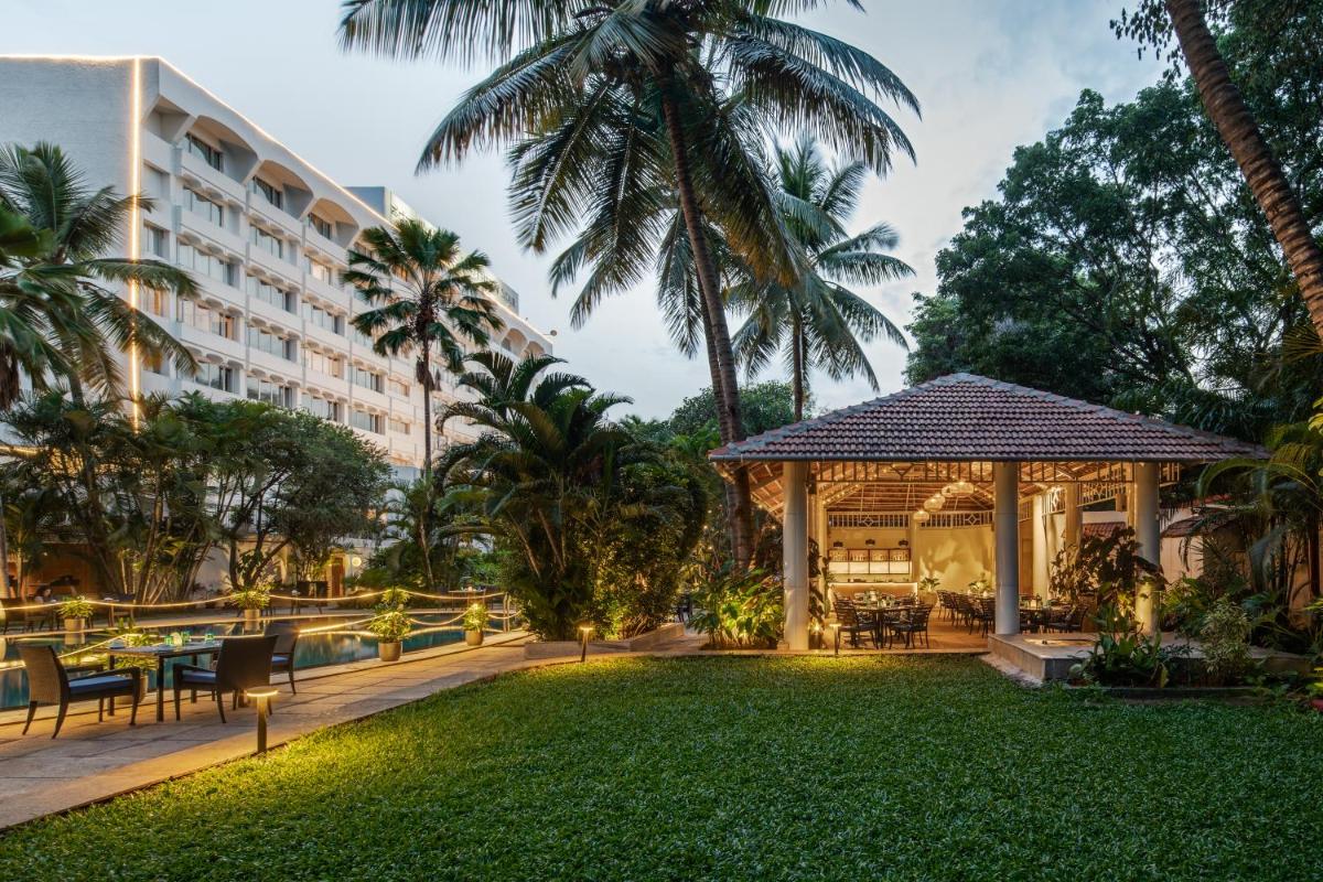 a garden with a gazebo and a hotel at Southern Star,Mysore in Mysore