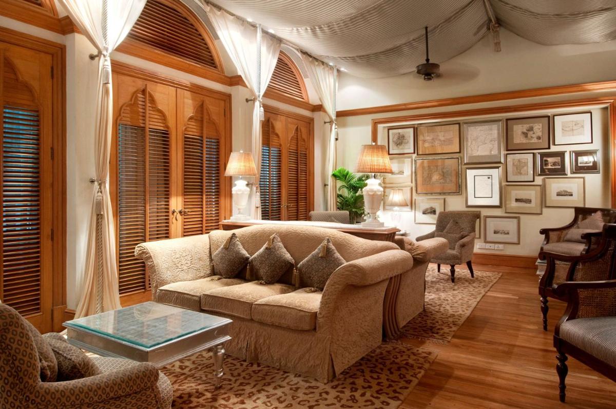 a living room with a couch and a table at Hilton Mumbai International Airport Hotel in Mumbai