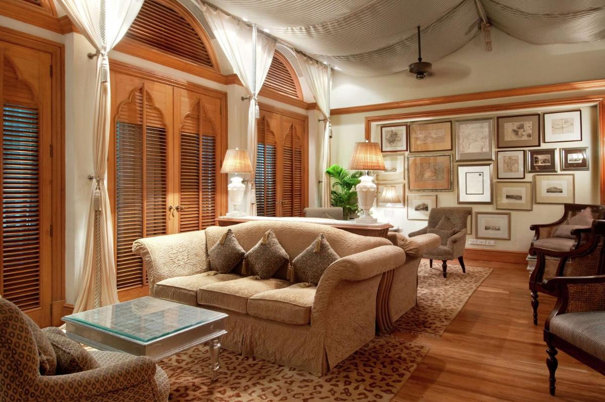 a living room with a couch and a table at Hilton Mumbai International Airport Hotel in Mumbai