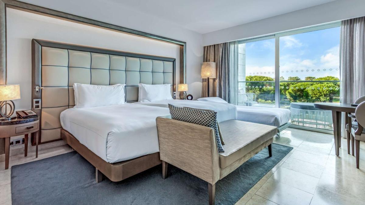 Uma cama ou camas num quarto em Conrad Algarve