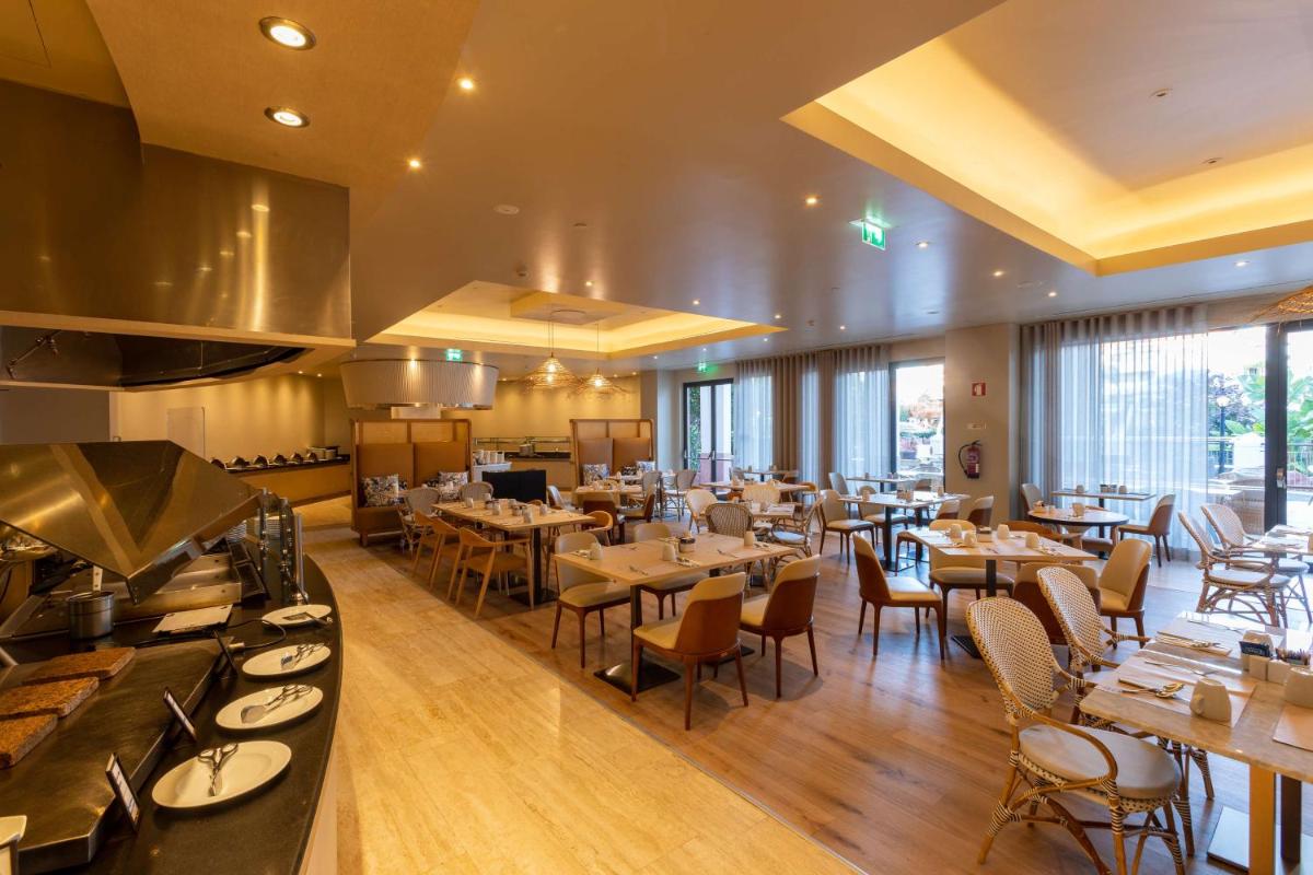 Um restaurante ou outro lugar para comer em Hilton Vilamoura