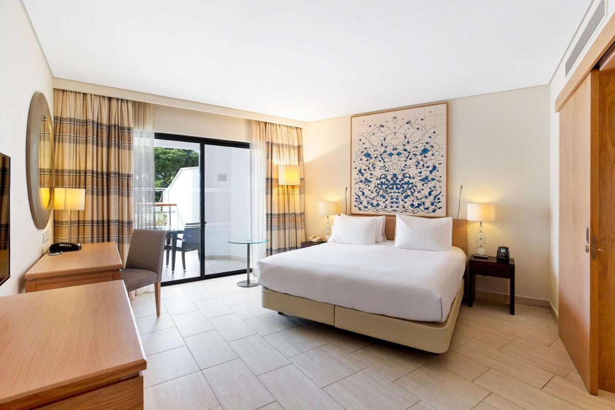 Uma cama ou camas num quarto em Hilton Vilamoura