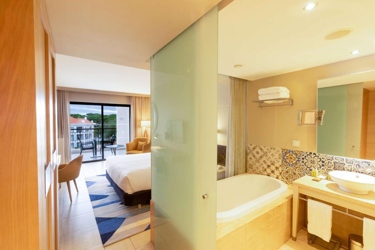 Uma cama ou camas num quarto em Hilton Vilamoura