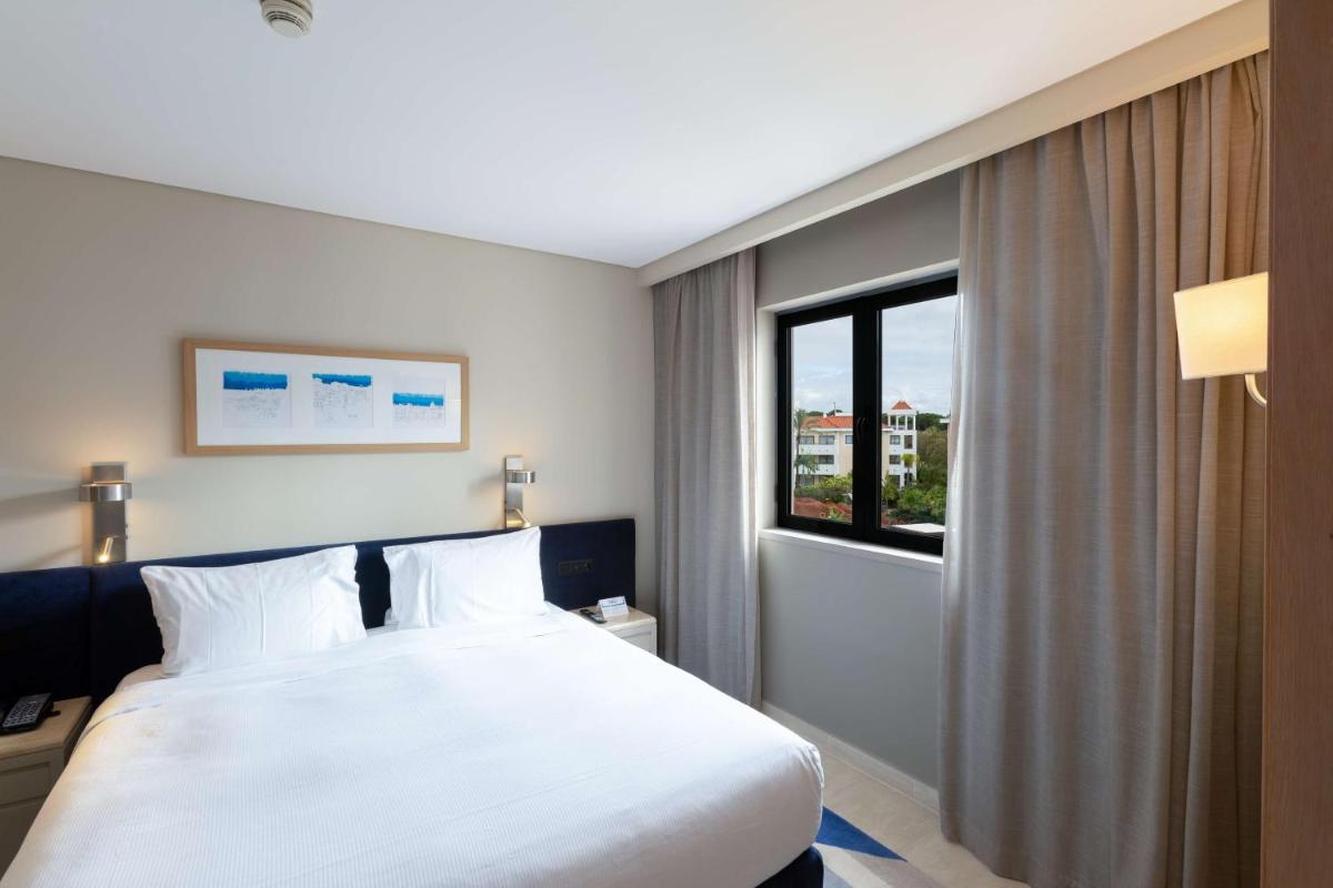Uma cama ou camas num quarto em Hilton Vilamoura