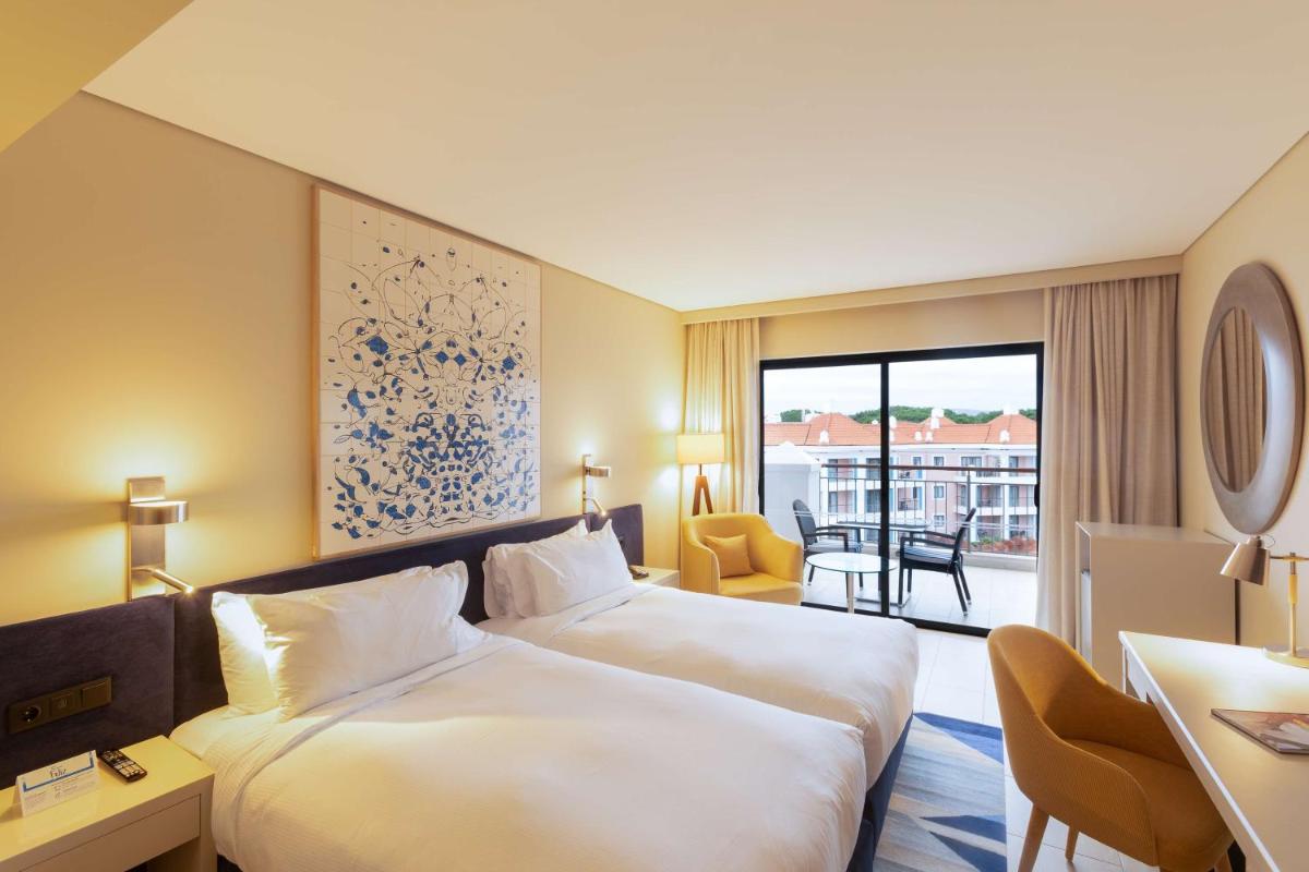 Uma cama ou camas num quarto em Hilton Vilamoura