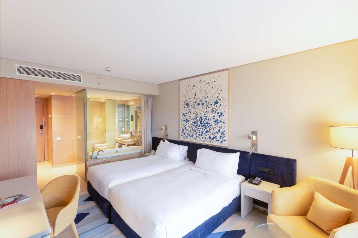 Uma cama ou camas num quarto em Hilton Vilamoura