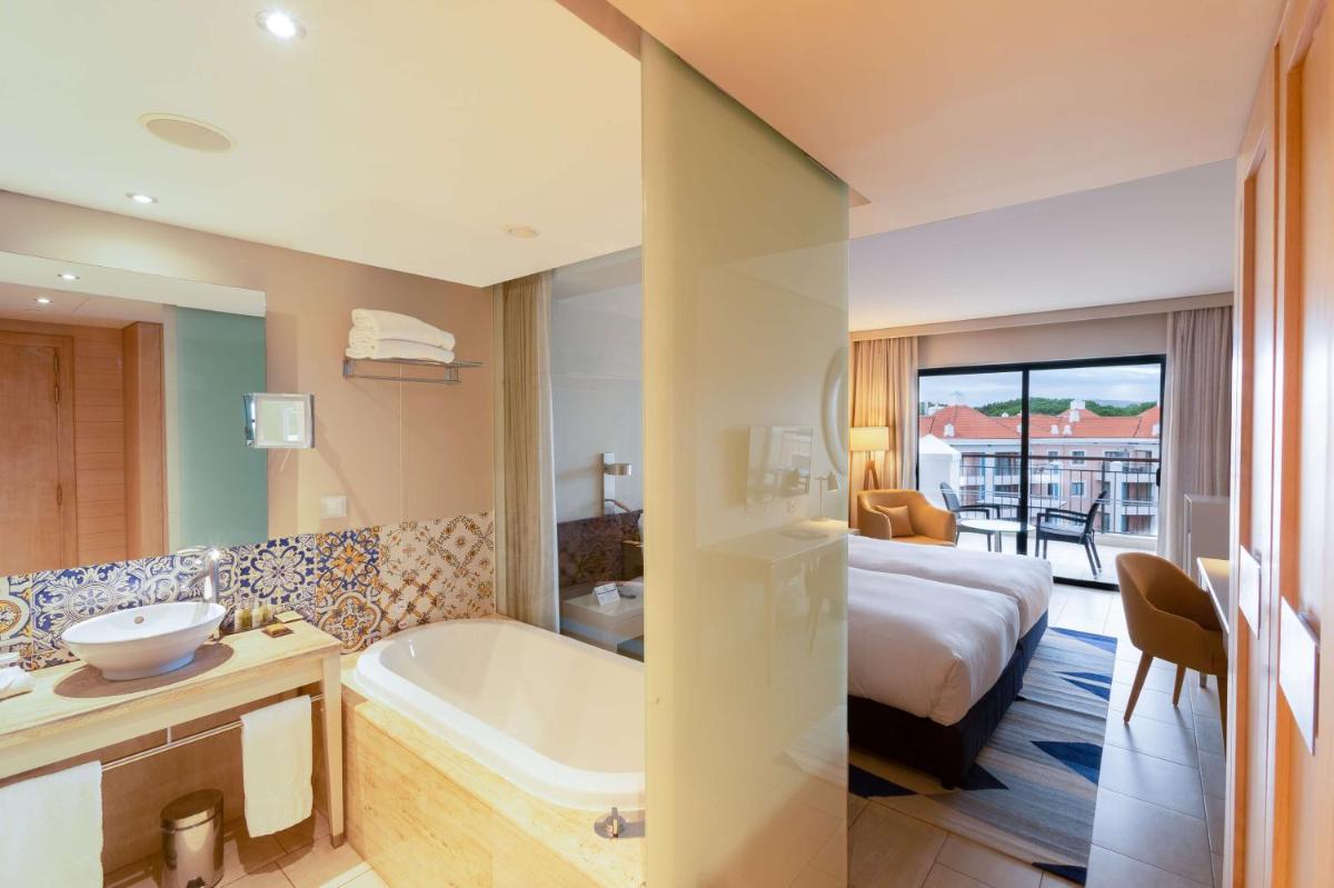 Uma cama ou camas num quarto em Hilton Vilamoura
