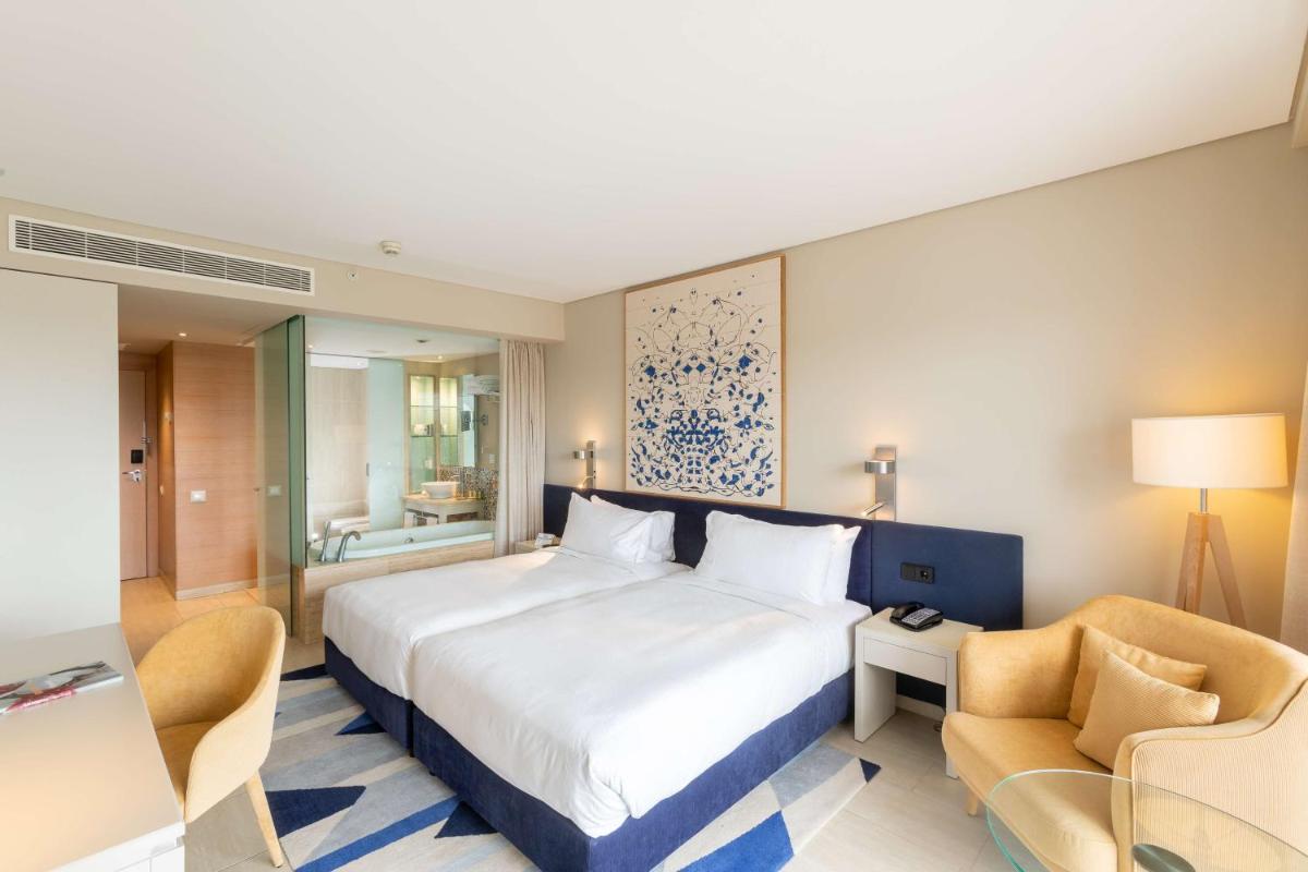 Uma cama ou camas num quarto em Hilton Vilamoura