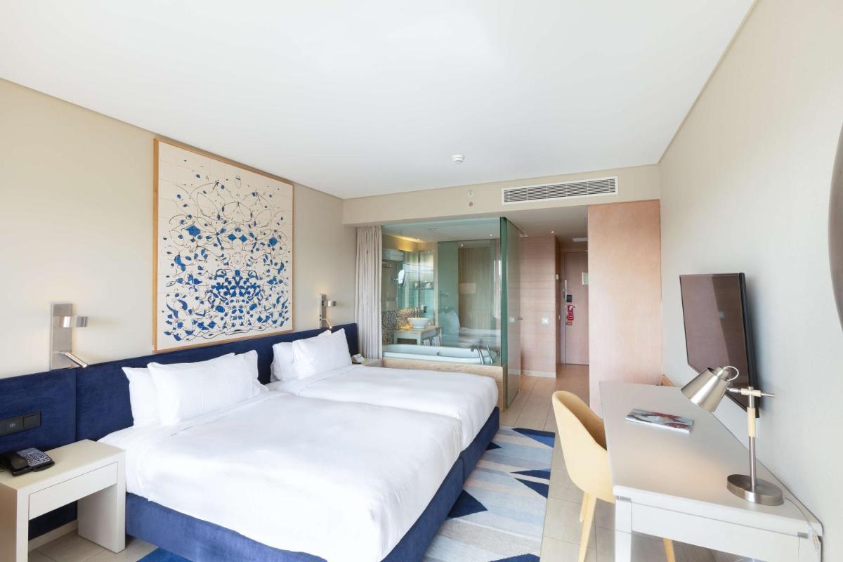 Uma cama ou camas num quarto em Hilton Vilamoura