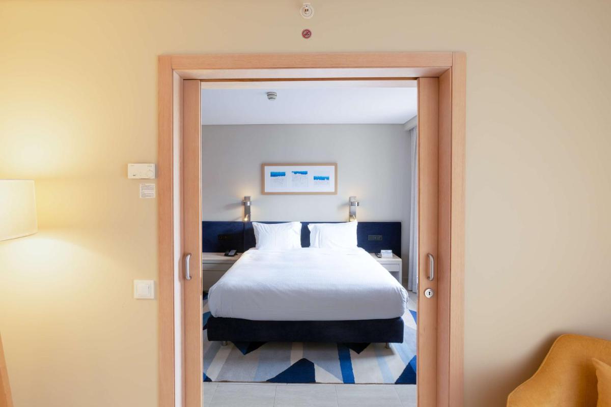 Uma cama ou camas num quarto em Hilton Vilamoura