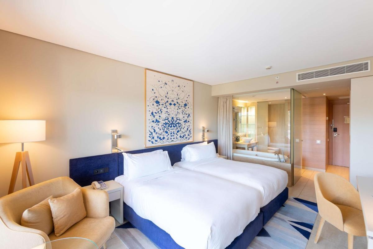 Uma cama ou camas num quarto em Hilton Vilamoura