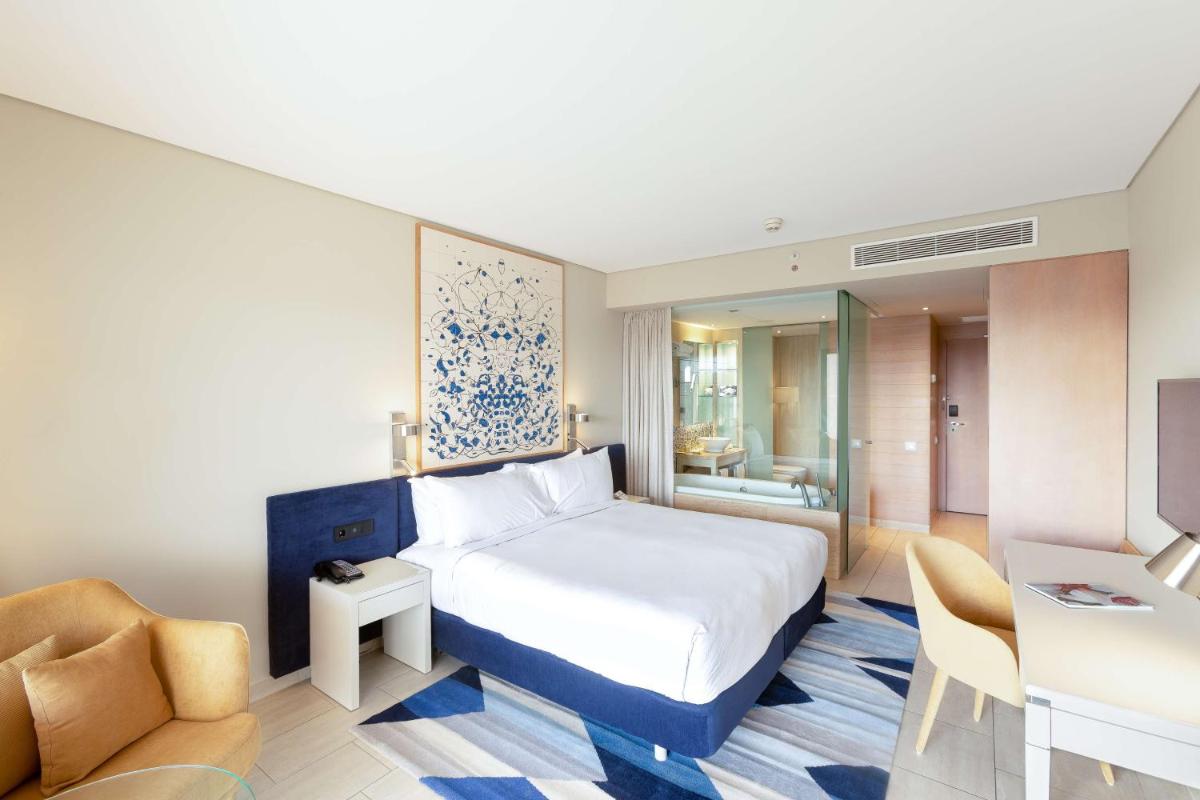 Uma cama ou camas num quarto em Hilton Vilamoura