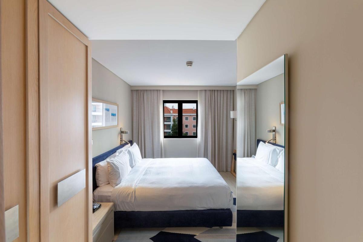 Uma cama ou camas num quarto em Hilton Vilamoura