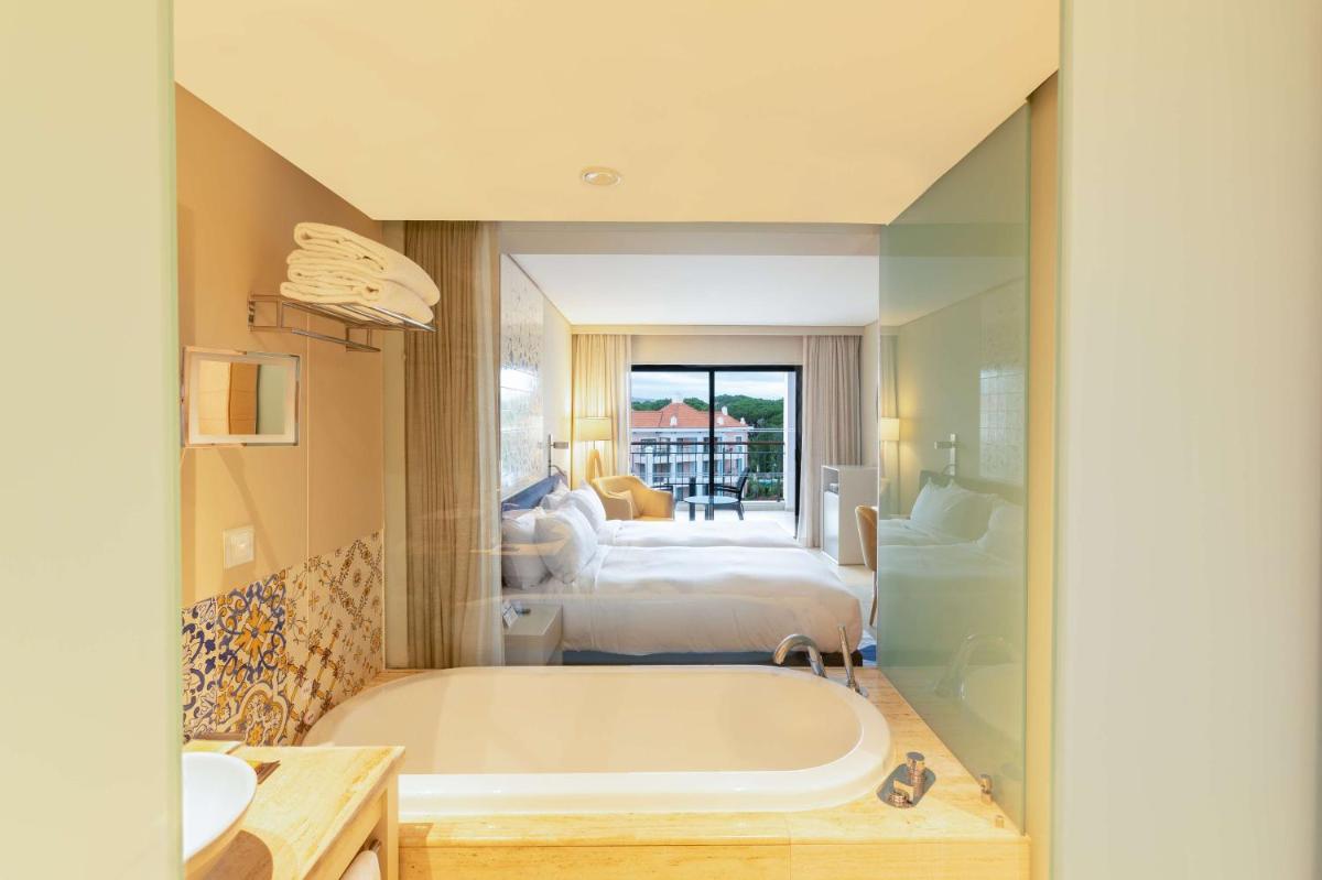 Uma cama ou camas num quarto em Hilton Vilamoura