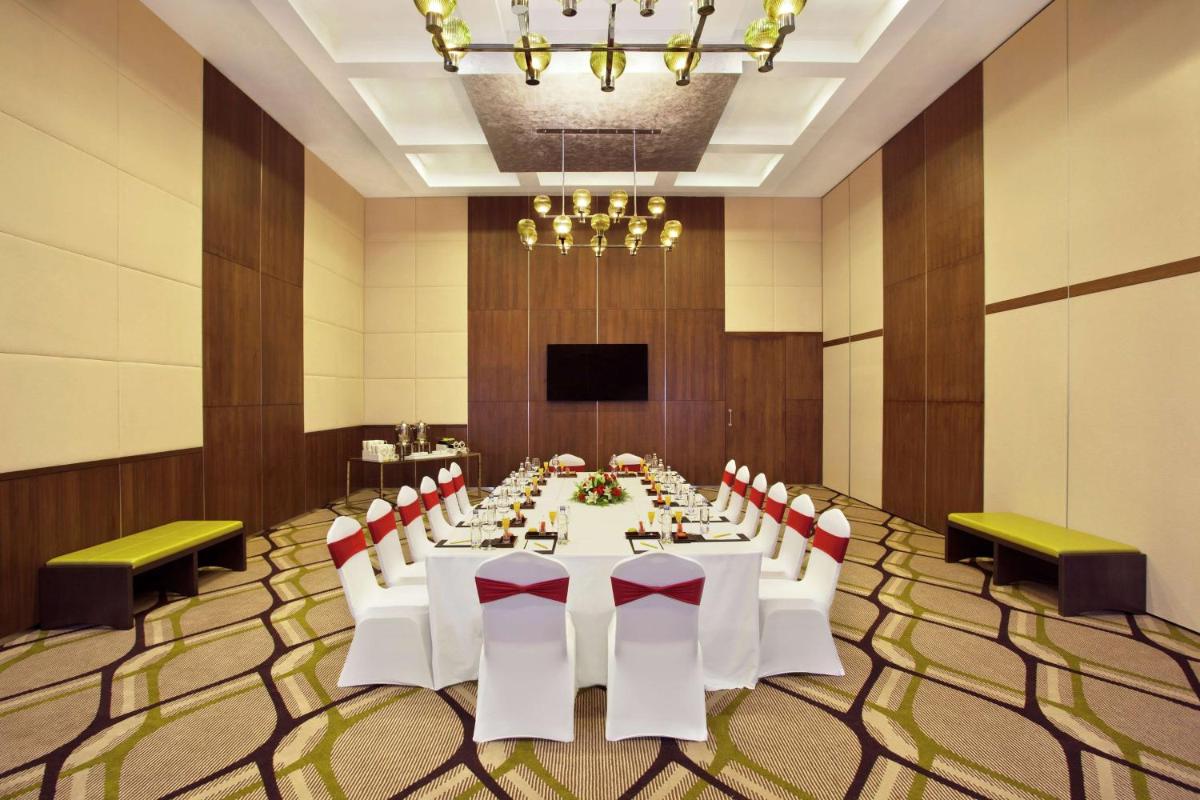 a conference room with a long table and chairs at Hilton Garden Inn, Trivandrum in Trivandrum
