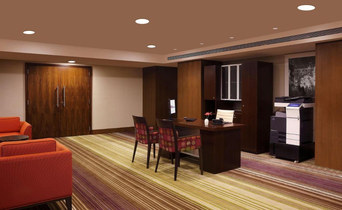 a conference room with a table and chairs at Hilton Garden Inn, Trivandrum in Trivandrum