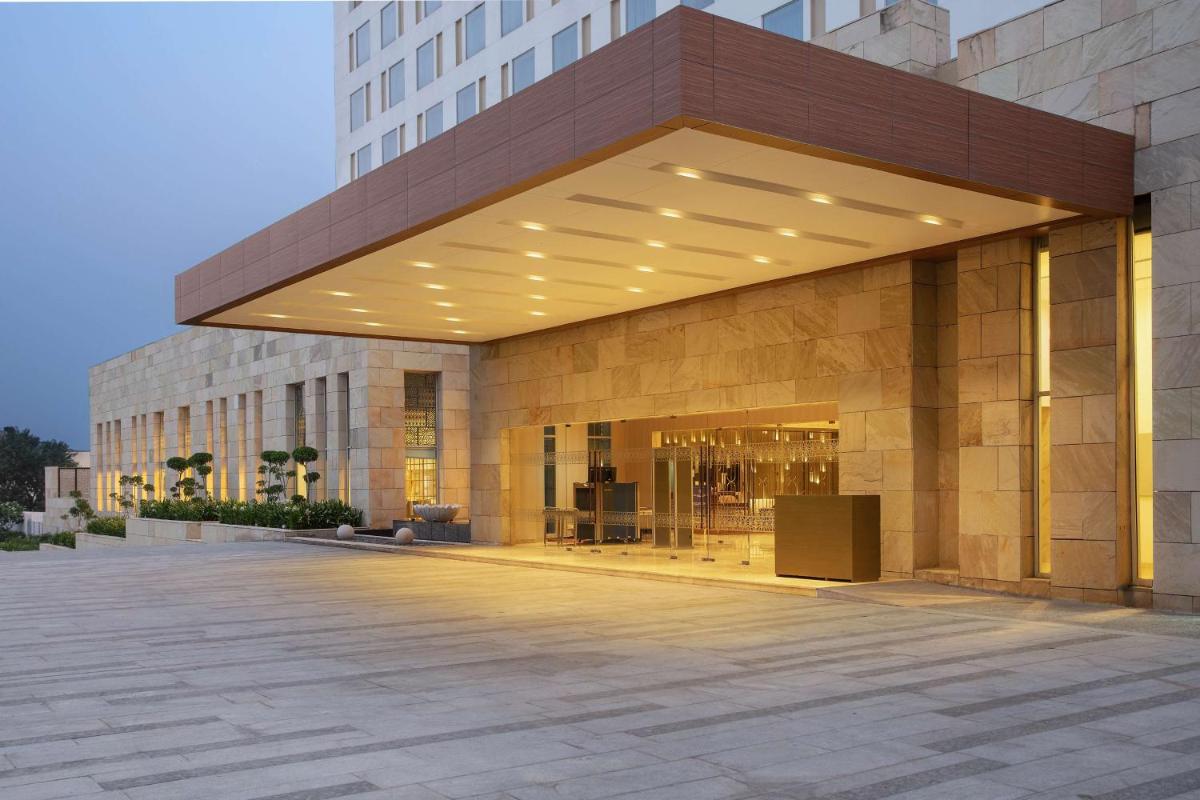 a lobby of a building with a large building at DoubleTree By Hilton Jaipur Amer in Jaipur