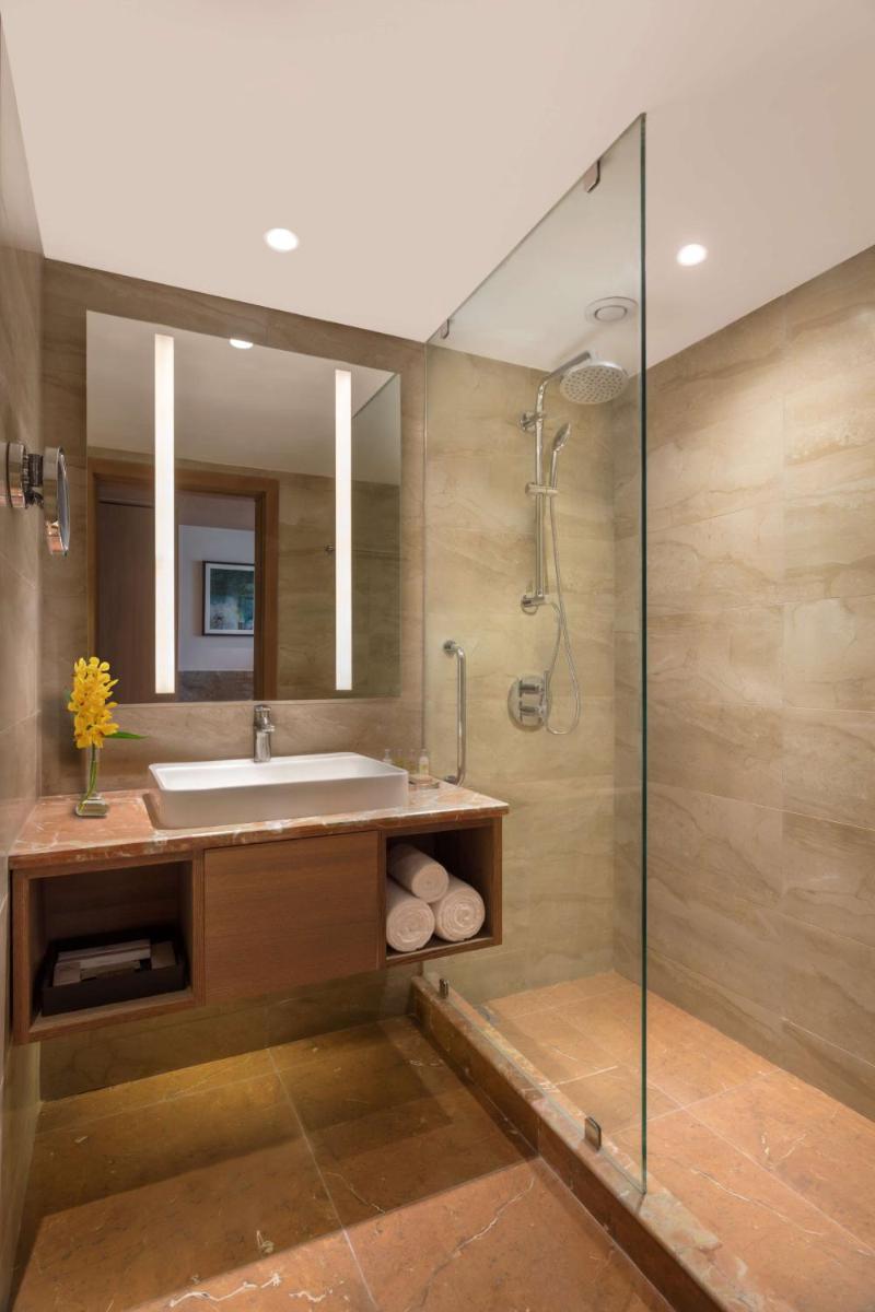 a bathroom with a sink and a shower at DoubleTree By Hilton Jaipur Amer in Jaipur