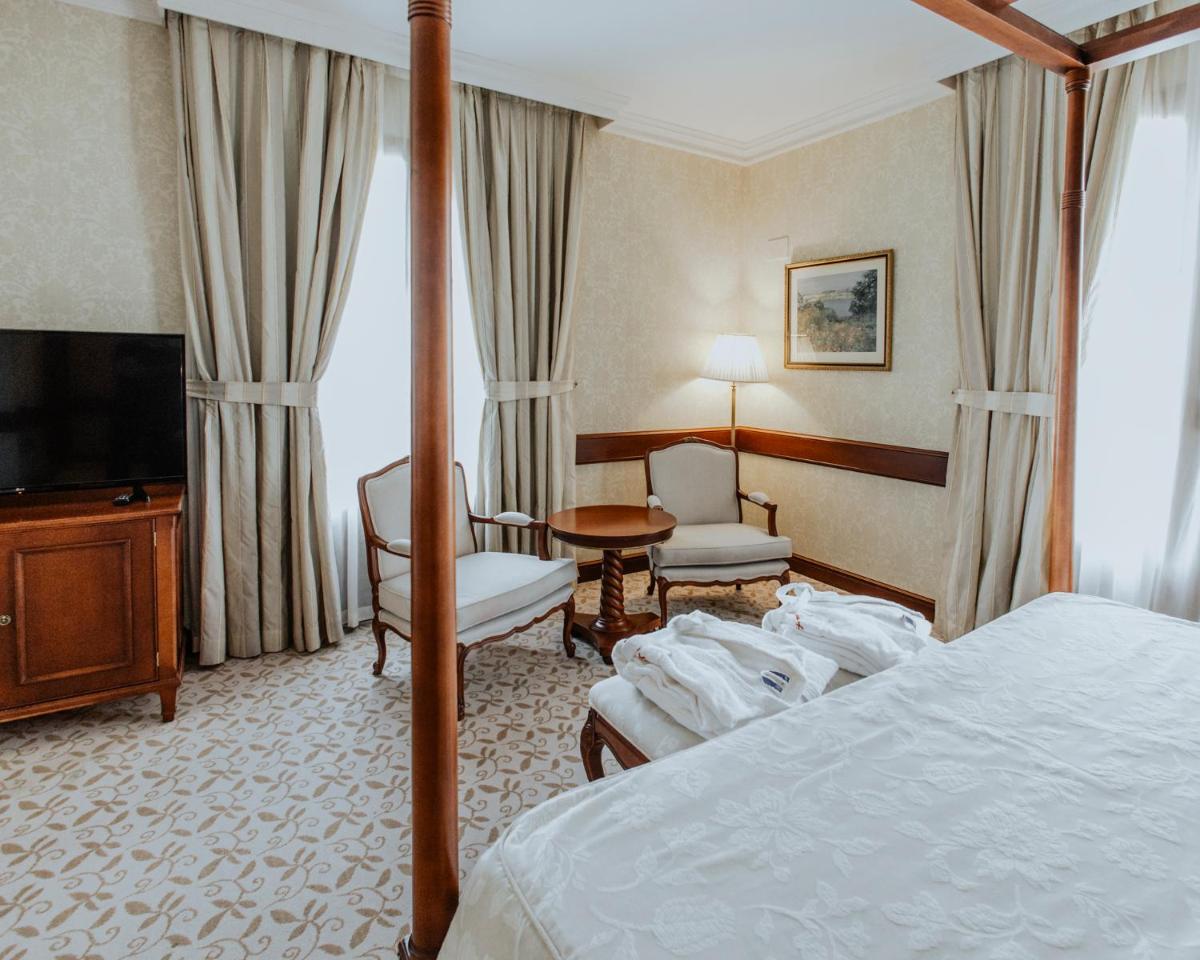Cama o camas de una habitación en Hotel Cándido
