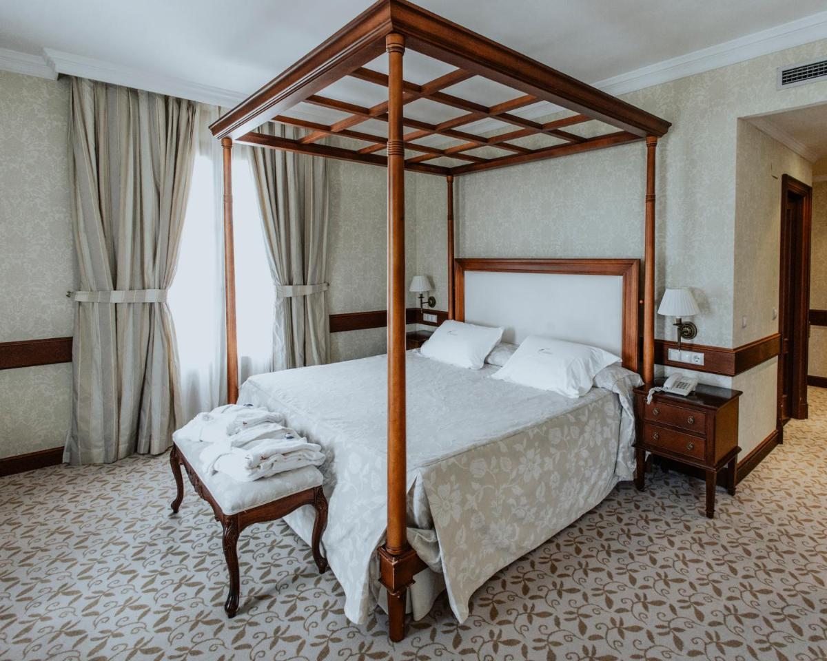 Cama o camas de una habitación en Hotel Cándido