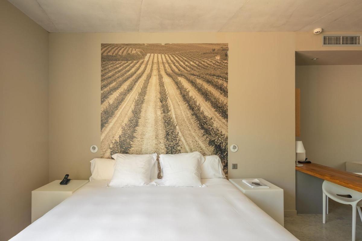 Cama o camas de una habitación en Hotel Viura
